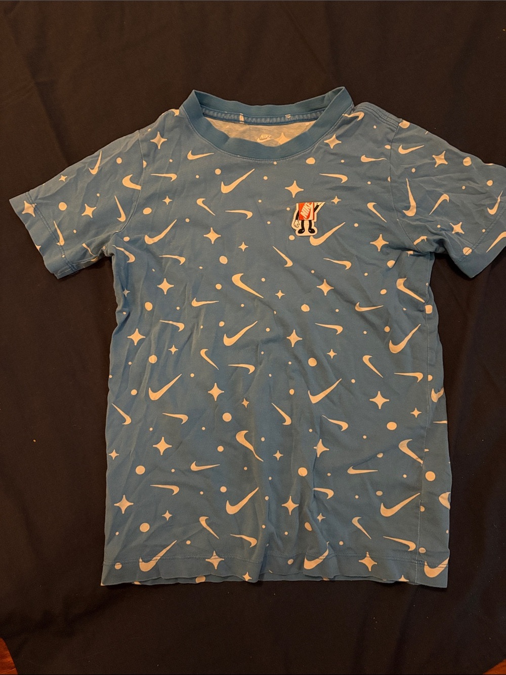 Nike Blue Short-Sleeve Tee with White Swoosh Pattern